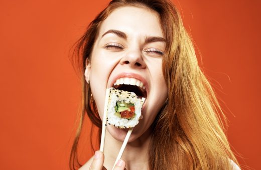 woman eating rolls portrait asia